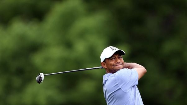 Woods shoots 70 as Moore takes clubhouse lead at Memorial Woods shoots 70 as Moore takes clubhouse lead at Memorial