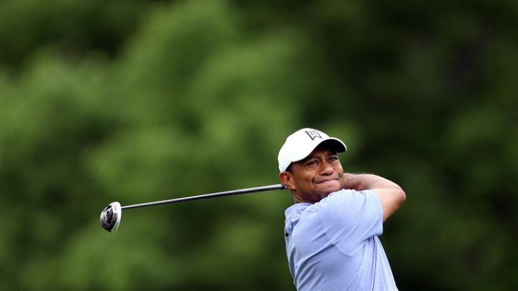 Woods shoots 70 as Moore takes clubhouse lead at Memorial