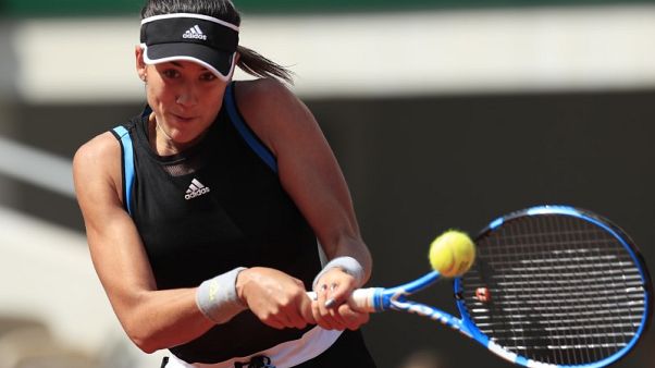 Muguruza powers past Svitolina into French Open fourth round Muguruza powers past Svitolina into French Open fourth round