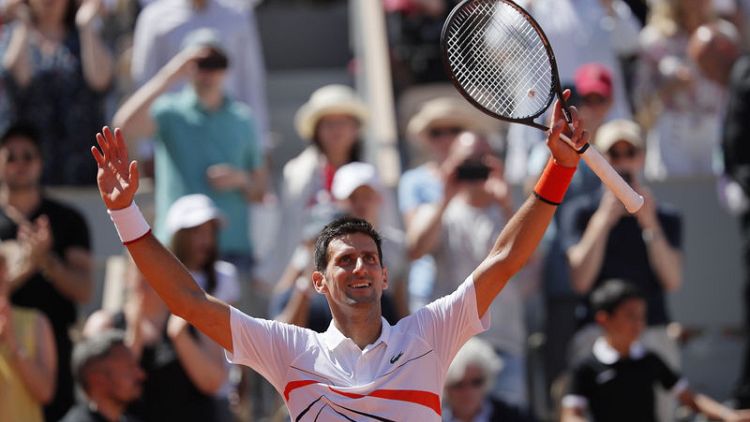 Djokovic saunters into French Open fourth round