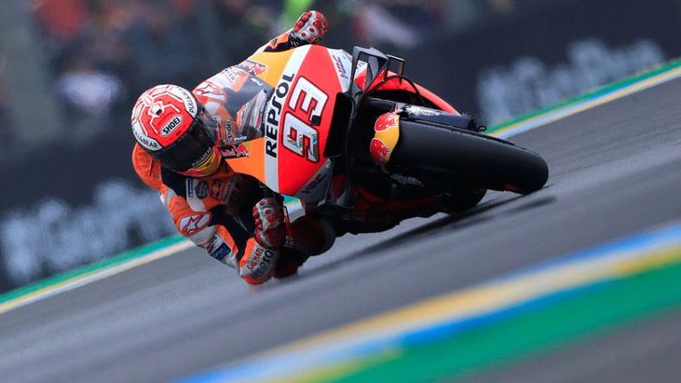 Motorcycling - Marquez smashes lap record to take pole in Italy