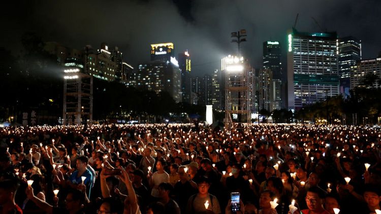 Hong Kong holds sombre Tiananmen vigil as Beijing goes into lockdown