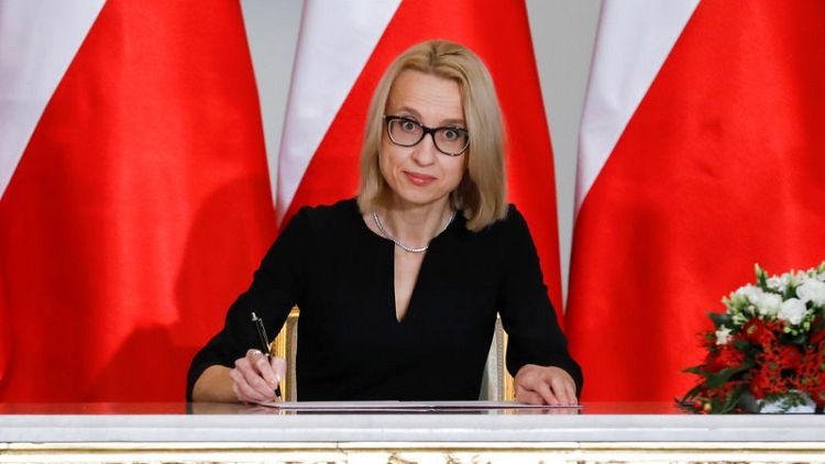 Poland replaces finance minister with head taxman