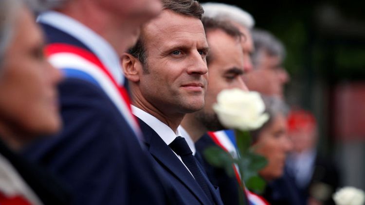 Macron pays D-Day tribute to Resistance victims of Caen prison massacre