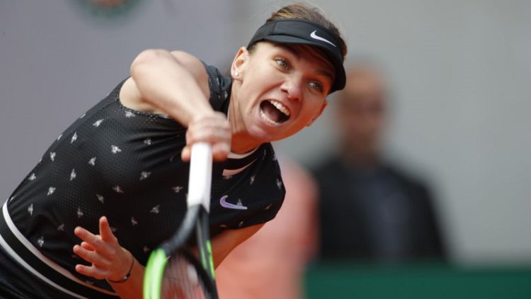 Defending champion Halep knocked out of French Open