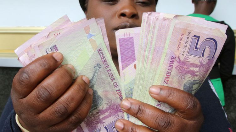 Zimbabwe president says new currency a must by year-end