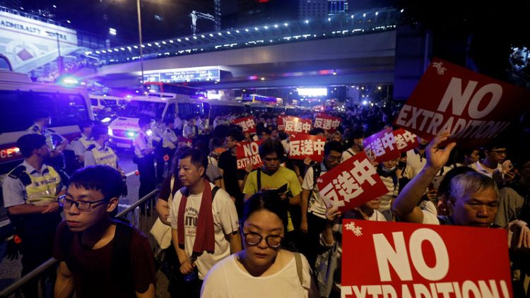 Hundreds of thousands march in Hong Kong to protest China extradition bill