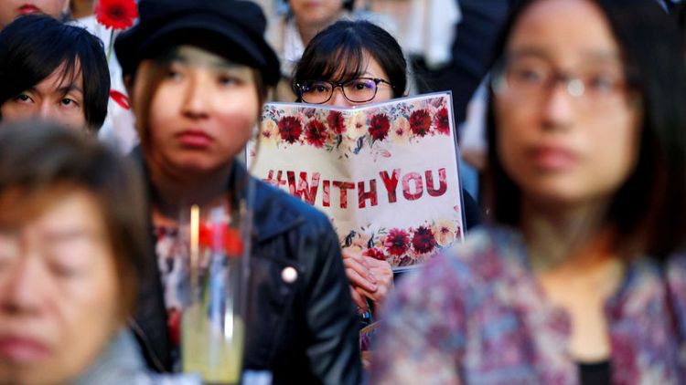 With flowers and personal stories, Japan sexual abuse survivors seek reform