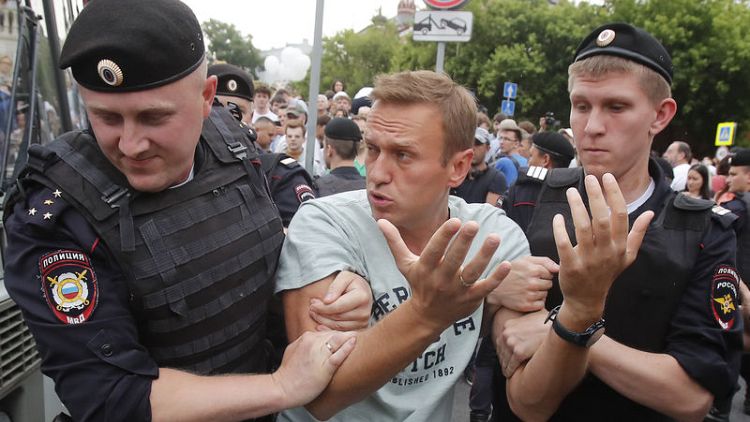 Russian police detain more than 400 at protest over journalist
