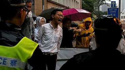 Protesters scuffle with Hong Kong police, government offices shut Protesters scuffle with Hong Kong police, government offices shut