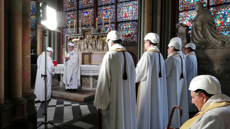 Worshippers in safety hats attend Notre-Dame's first mass since fire