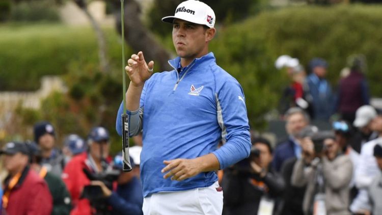 Golf: Woodland holds nerve to stay top at U.S. Open