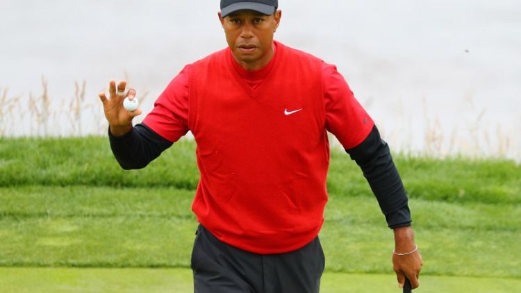 Woods closes on upbeat note, no happy birthday for Mickelson