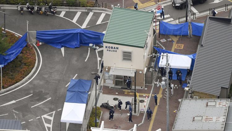 Japan arrests man for stabbing police officer, taking gun