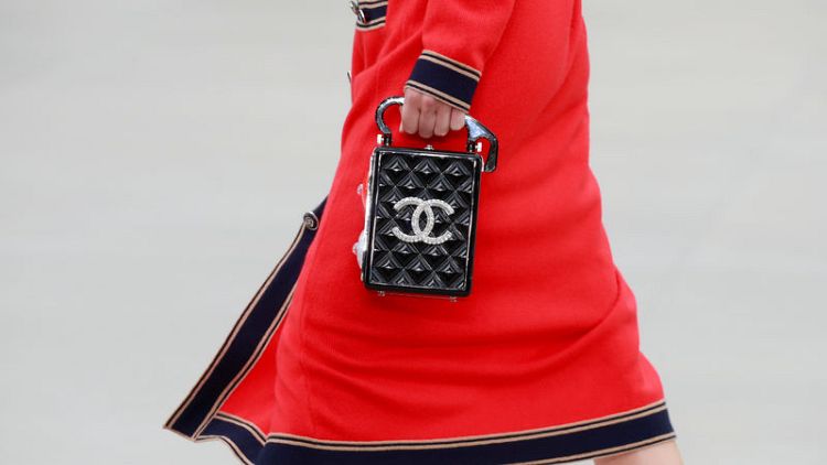 Fashion house Chanel parades its independence as its profits rise