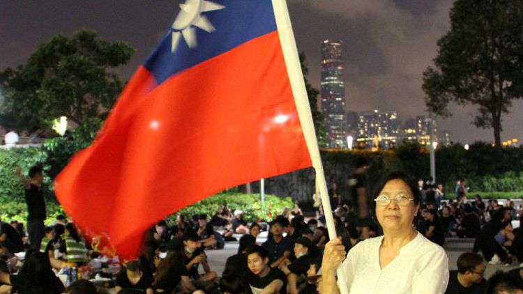 Many in Hong Kong, fearful of China's grasp, look longingly towards Taiwan