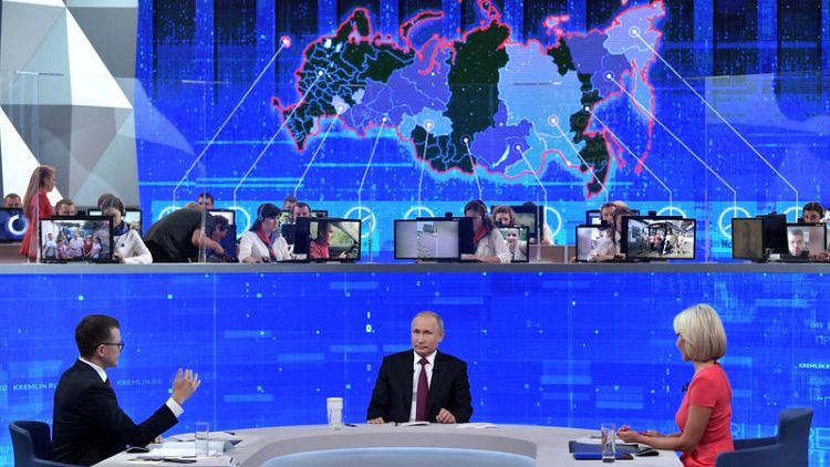 Putin, hit by ratings drop, tells Russians a better life awaits