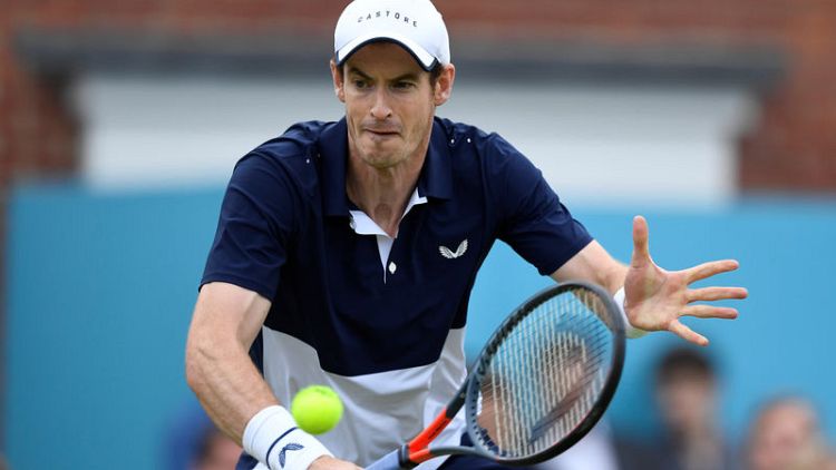 Murray marks return with doubles win