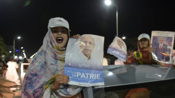 Ses partisans célèbrent la victoire du candidat du pouvoir à la présidentielle en Mauritanie, Mohamed Ould Ghazouani, le 23 juin dans les rues de Nouakchott. Ses partisans célèbrent la victoire du candidat du pouvoir à la présidentielle en Mauritanie, Mohamed Ould Ghazouani, le 23 juin dans les rues de Nouakchott.