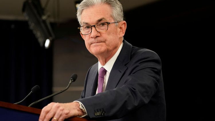 Powell says Fed is wrestling with whether to cut rates, insulated from politics