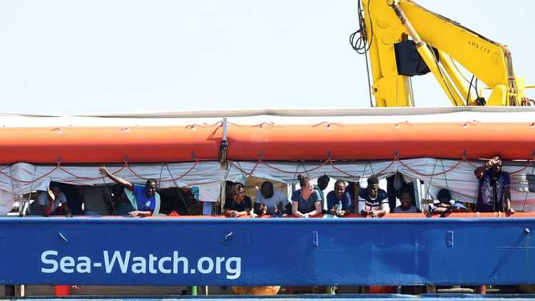 Migrant rescue boat enters Italian waters, defying government ban