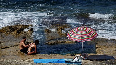 School closures, frozen bananas and faith: Europeans struggle with heatwave School closures, frozen bananas and faith: Europeans struggle with heatwave