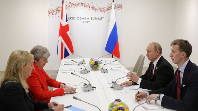 May tells Putin that Russia must end 'irresponsible activity'