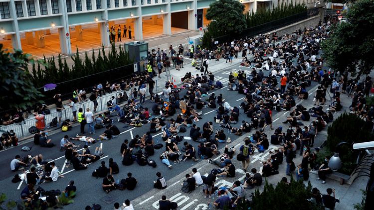 Hong Kong anti-extradition protesters rally again near government offices