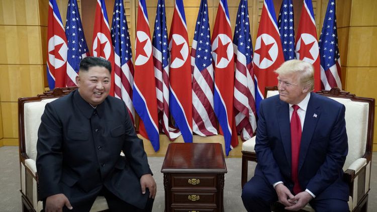 Trump holds historic meeting with Kim with a tweet, handshake and 'flowers of hope'