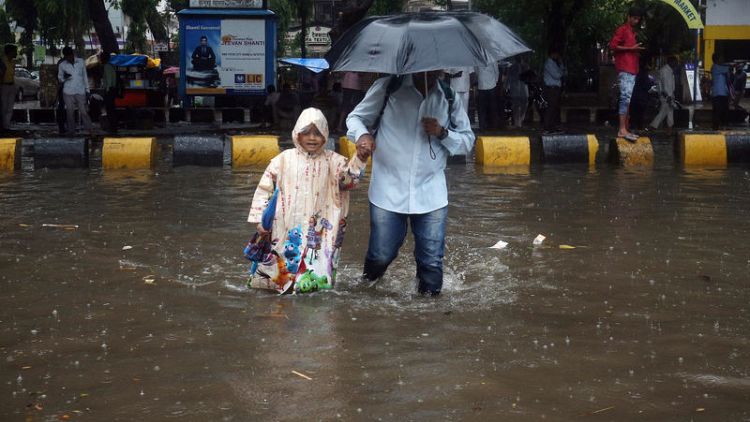 Heavy rains batter India's Mumbai, disrupting air, rail traffic