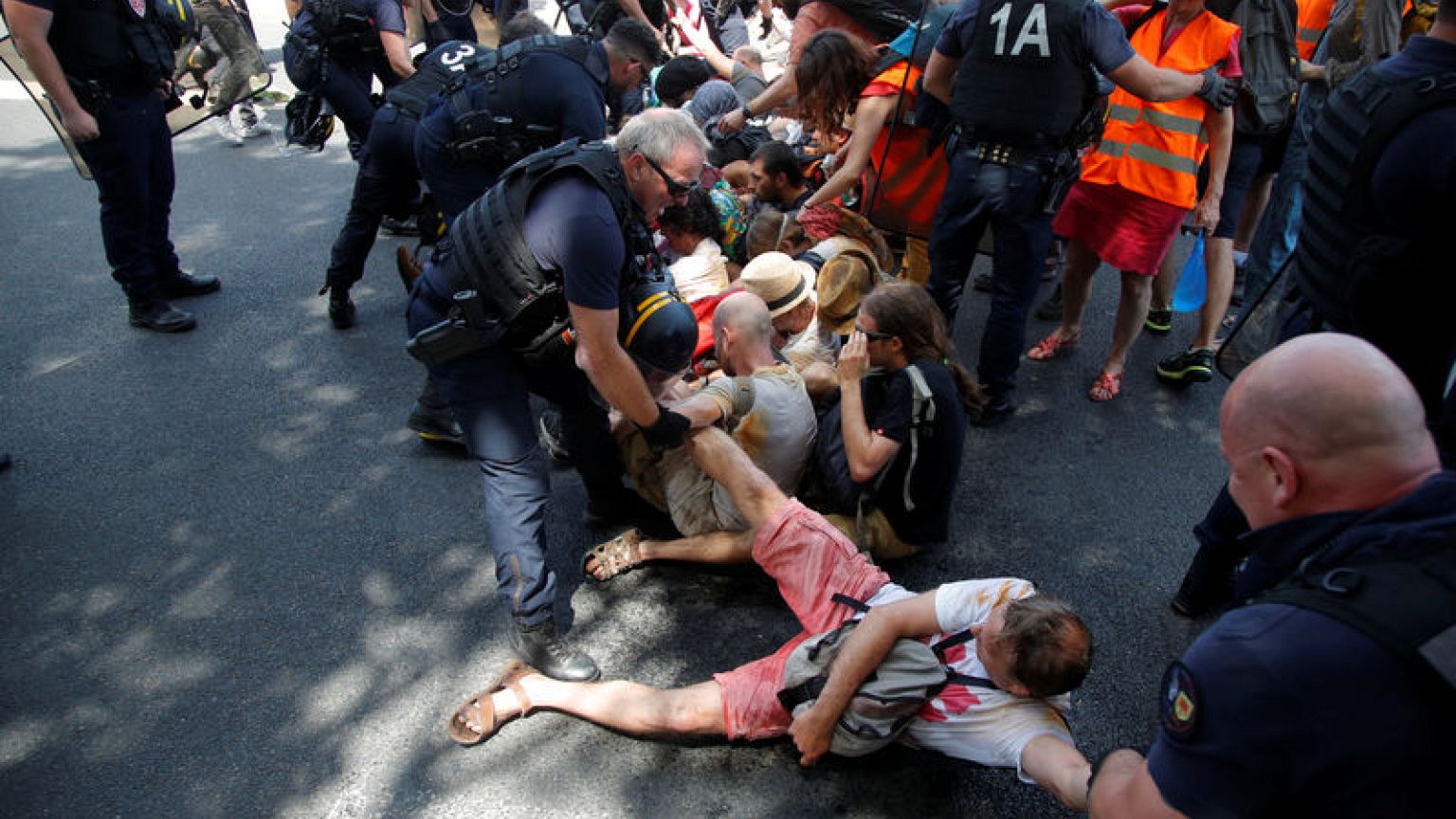 French police probed over rough break-up of climate demo
