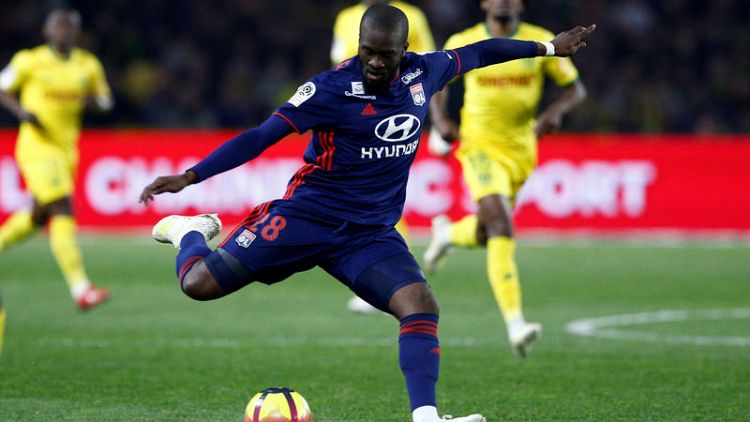 Tottenham secure midfielder Ndombele from Lyon for club-record fee