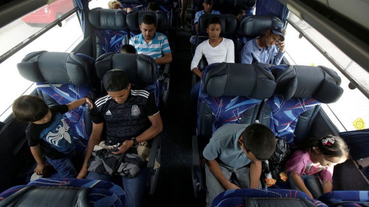 Mexico buses home migrants who gave up on U.S. asylum claims