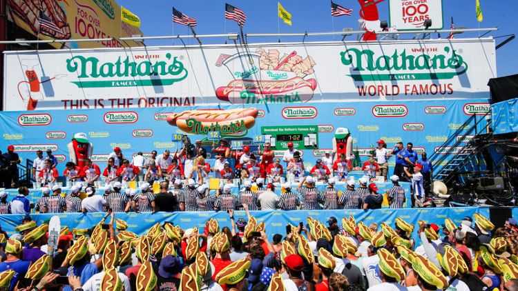 Chestnut crowned July 4 hot-dog champ again but can't top his own record