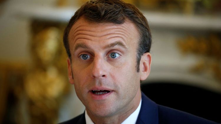Seeking reset with journalists, Macron keeps press room inside Elysee