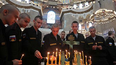 Putin bestows top state honours on sailors killed in submarine fire Putin bestows top state honours on sailors killed in submarine fire