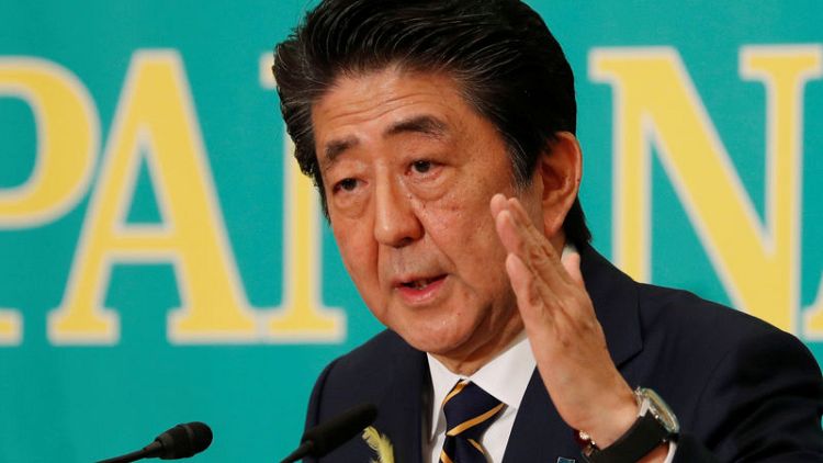 Japan PM Abe's coalition on track to win solid majority in election - media