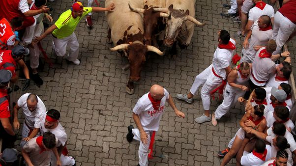 Three people gored on first day of Spanish bull-running festival Three people gored on first day of Spanish bull-running festival