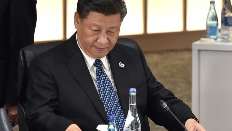China's Xi tells officials not to be lazy and 'spend whole day eating'