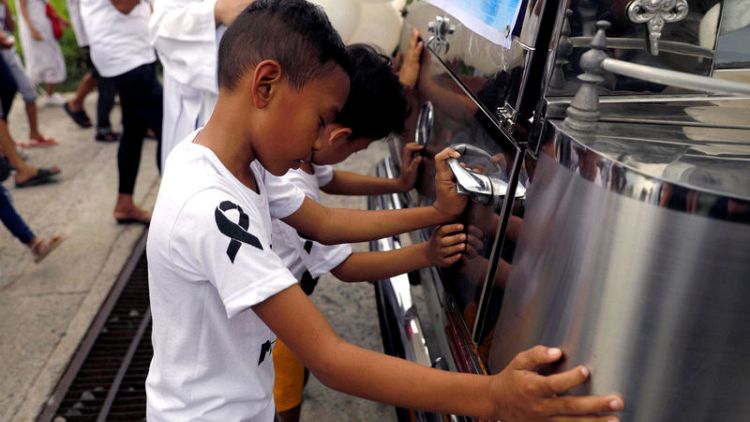 Calls for justice, intervention as Philippines buries drug war's youngest known victim