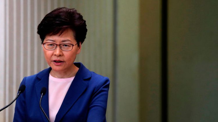 China's top official in Hong Kong says Beijing backs city's leader