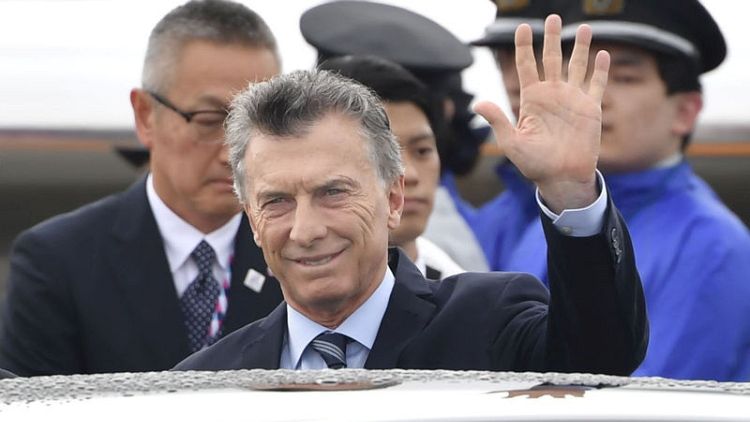 Argentine President Macri picked in poll to narrowly win re-election