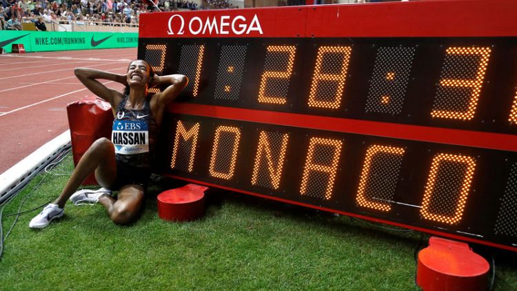 Hassan breaks women's mile world record on emotional night
