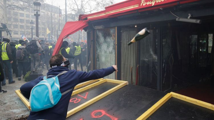 Ransacked in 'yellow vest' riot, chic Fouquet's eatery reopens in Paris