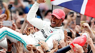 Hamilton flies the flag with pride in record British GP win Hamilton flies the flag with pride in record British GP win
