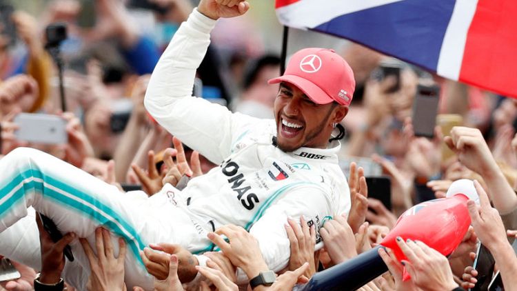 Hamilton flies the flag with pride in record British GP win