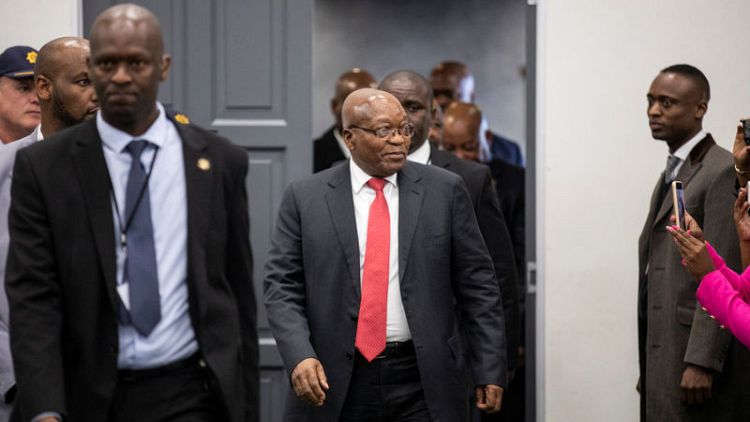 Defiant at inquiry, South Africa's Zuma denies breaking law with business brothers