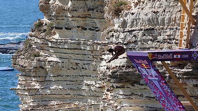 Cliff divers leap from Beirut landmark in international tour Cliff divers leap from Beirut landmark in international tour