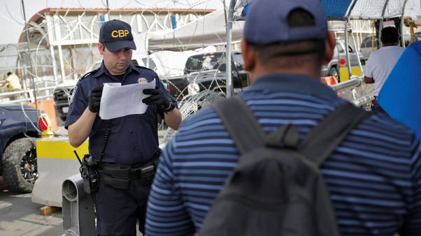 Asylum seekers anxiously cross into U.S. as new policy kicks in Asylum seekers anxiously cross into U.S. as new policy kicks in