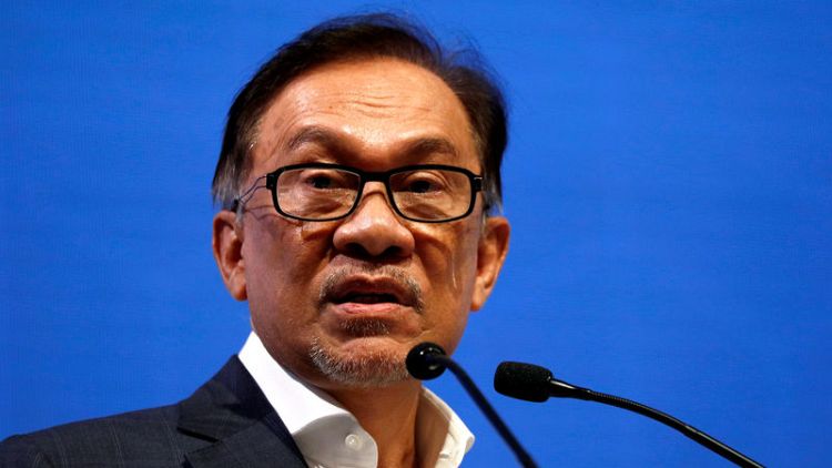 Malaysia's Anwar says he has support to become PM, decries sex tape "gutter politics"